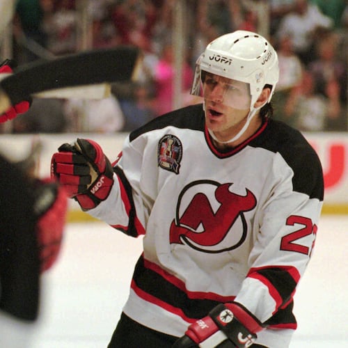 FILE - New Jersey Devils Claude Lemieux is greeted at the bench after scoring a goal in the first period of Game 3 of the NHL Stanley Cup Finals against the Detroit Redwings Thursday, June 22, 1995 at the Meadowlands in East Rutherford, N.J. (AP Photo/Bill Kostroun , File)