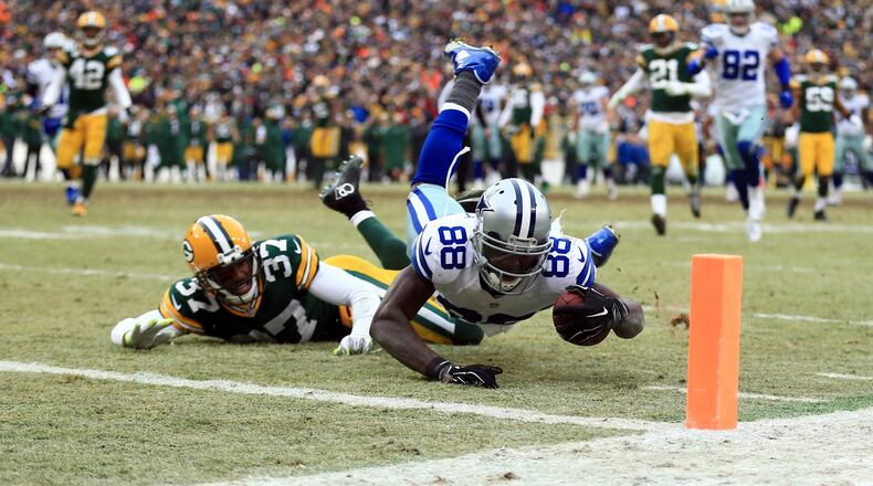 Dallas Cowboys wide receiver Dez Bryant (88) is unable to catch a pass against Green Bay Packers cornerback Sam Shields (37) in the fourth quarter in the 2014 NFC Divisional playoff football game at Lambeau Field.