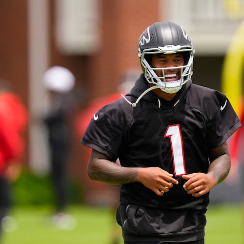 Atlanta Falcons quarterback's Michael Penix Jr. and Tua Tagovailoa (1) move during an NFL football practice, Wednesday, May 27, 2026, in Flowery Branch, Ga. (AP Photo/Mike Stewart)