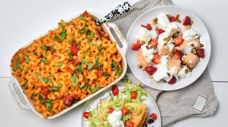 TikTok exposure helped us bring you these recipes: (clockwise starting at top left) Baked Feta Pasta, Cloud Bread with Strawberries and Cream, and Crunchwrap Tortilla Hack. Styling by Kate Williams / Chris Hunt for the AJC