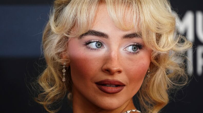 FILE - Sabrina Carpenter arrives at the 67th annual Grammy Awards on Feb. 2, 2025, in Los Angeles. (Photo by Jordan Strauss/Invision/AP, File)