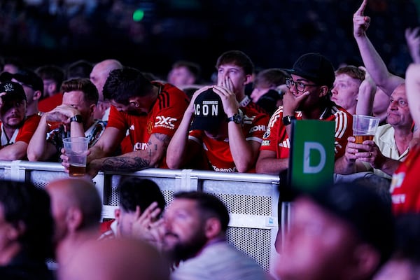 Manchester United fans react during a screening of the Europa League final soccer match between Manchester United and Tottenham Hotspur taking place in Bilbao, at the AO Arena, Manchester, England, Wednesday, May 21, 2025. (Peter Byrne/PA via AP)