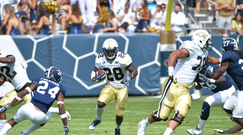 Georgia Tech A-back J.J. Green (28) runs against Georgia Southern defensive back Sean Freeman (24) in the first half at Bobby Dodd Stadium on Saturday, October 15, 2016. HYOSUB SHIN / HSHIN@AJC.COM
