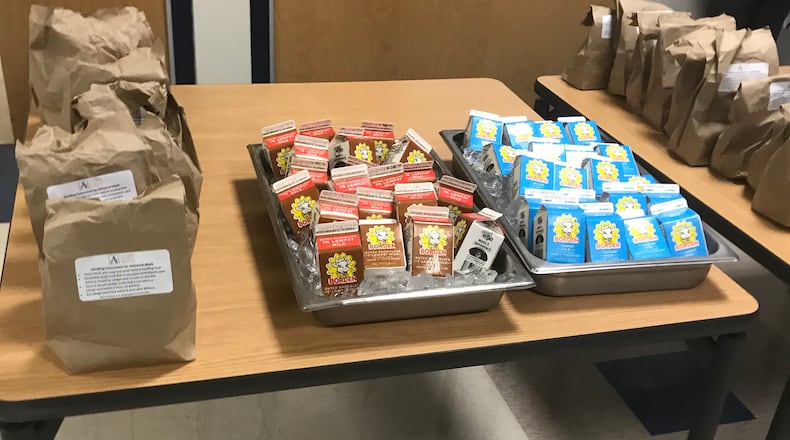 Atlanta Public Schools is providing free bagged breakfast and lunch meals at 10 school buildings . VANESSA McCRAY/AJC
