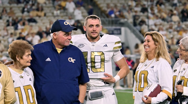 Georgia Tech quarterback Haynes King and his family react during a senior night event prior to the final regular-season home game against Pittsburgh at Bobby Dodd Stadium, Saturday, Nov. 22, 2025, in Atlanta. (Hyosub Shin/AJC)