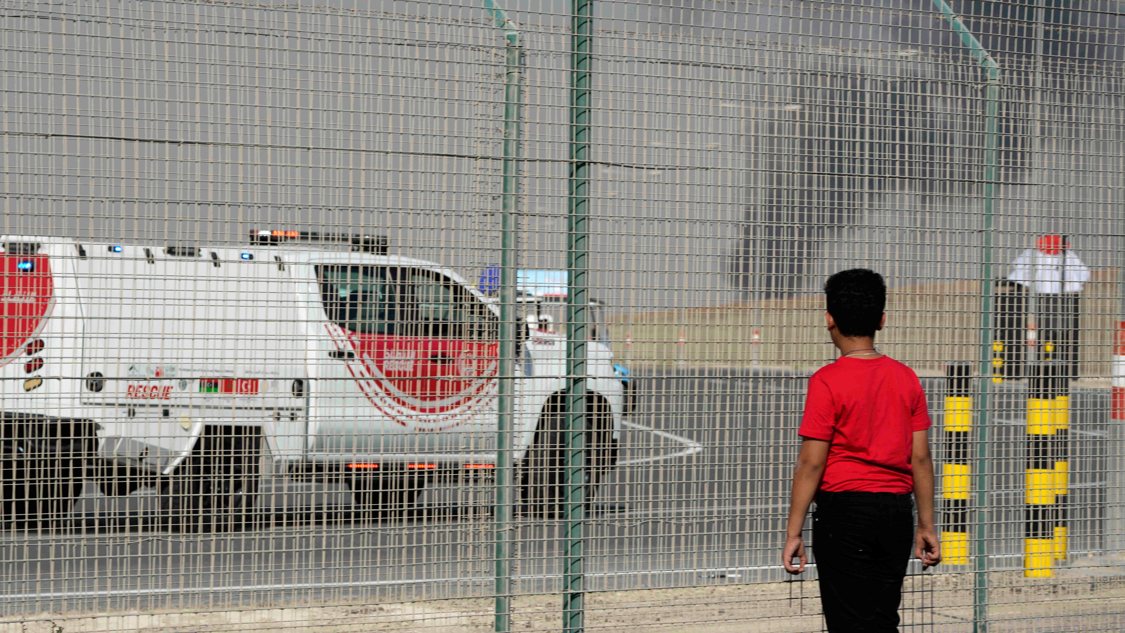A bystander watches as an Indian HAL Tejas crashes during a demonstration at the Dubai Air Show, at Al Maktoum International Airport at Dubai World Central, Dubai, United Arab Emirates, Friday Nov. 21, 2025. (AP Photo/Jon Gambrell)