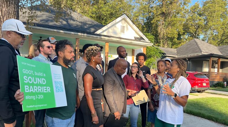 Residents of Atlanta's Westside are urging officials to build a five-mile barrier along I-20 to protect their communities from noise, debris and pollution.