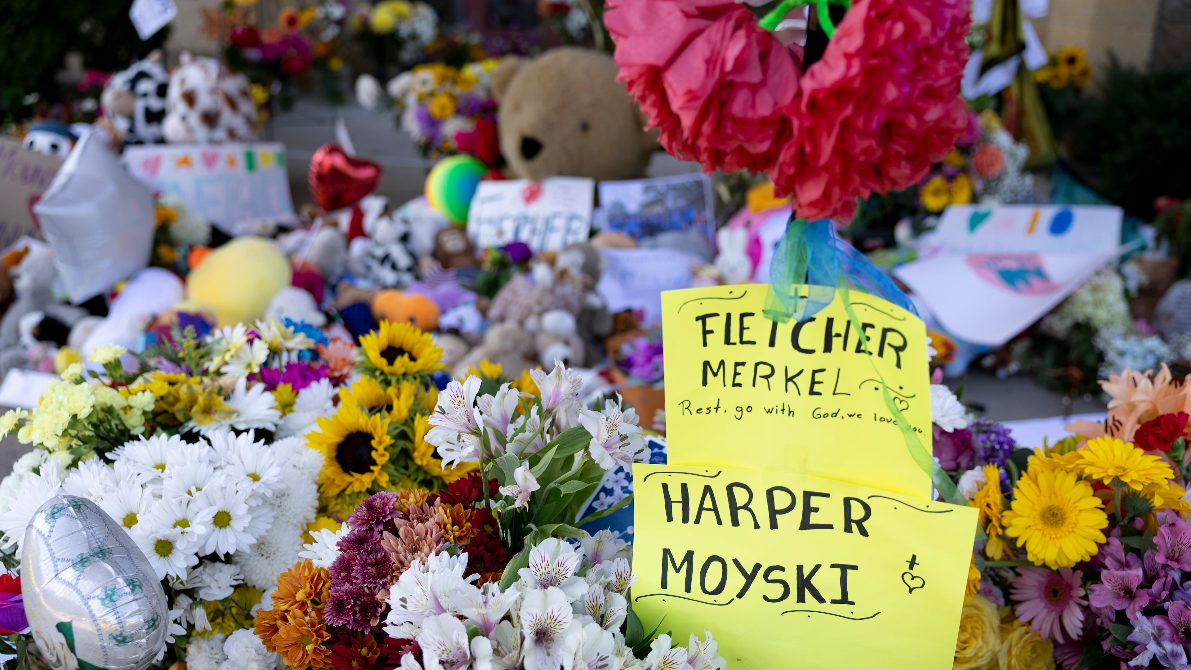 A sign honors the two victims who died in the shooting, 8-year-old Fletcher Merkel and 10-year-old Harper Moyski, outside Annunciation Catholic Church on Sunday, Aug. 31, 2025, in Minneapolis. (Ellen Schmidt/AP)