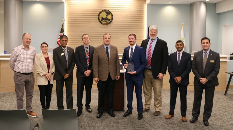 Johns Creek Public Works Director Chris Haggard and Transportation Engineer and Project Manager Matthew Simpson were recognized by Johns Creek City Council for their Innovation Solution award for the Brumbelow Road and Tuckerbrook Lane intersection project. COURTESY CITY OF JOHNS CREEK