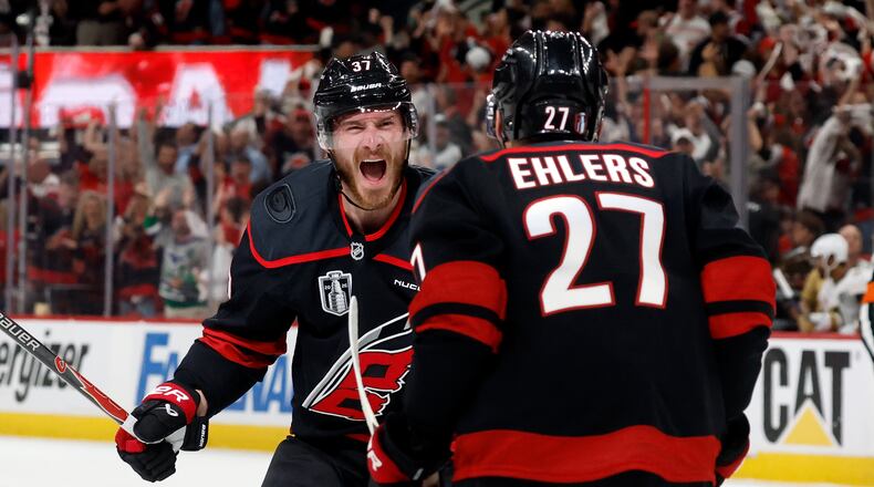 Carolina Hurricanes' Andrei Svechnikov (37) celebrates after his goal with Nikolaj Ehlers (27) during the second period in Game 5 of the NHL hockey Stanley Cup Final series against the Vegas Golden Knights in Raleigh, N.C., Thursday, June 11, 2026. (AP Photo/Karl DeBlaker)
