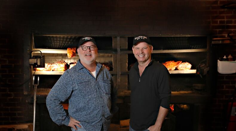 Larry Williamson (left) and brother Danny opened Williamson Bros. Bar-B-Q in 1990 with a location on Roswell Road in Marietta. CONTRIBUTED BY NATHAN PADGETT