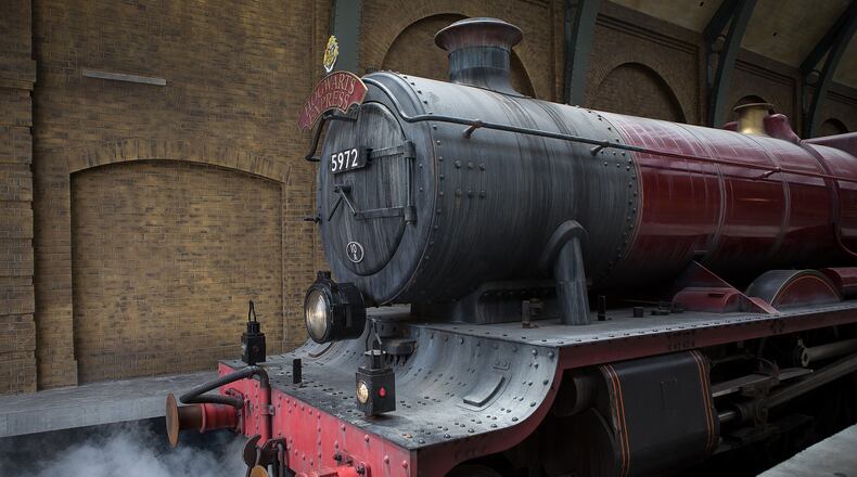 The Hogwarts Express pulls into Platform 9 3/4 at the Wizarding World of Harry Potter Diagon Alley on Thursday, June 19, 2014 at Universal Studios in Orlando. (Madeline Gray / The Palm Beach Post)