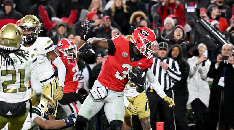 Georgia running back Nate Frazier (3) scores the game-winning 2-point conversion to beat Georgia Tech 44-42 in eight overtimes during an NCAA football game at Sanford Stadium, Friday, November 29, 2024, in Athens. (Hyosub Shin / AJC)