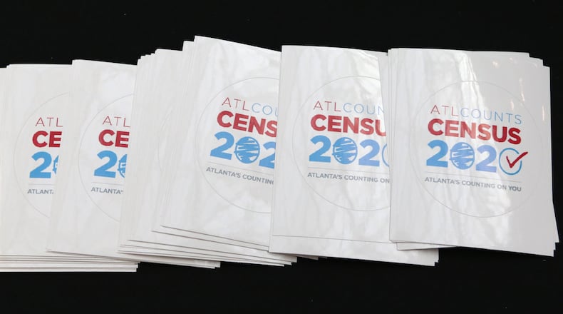 Stickers being handed out at a rally to announce the ATL Counts Census 2020 campaign at the Atlanta City Hall earlier this spring. EMILY HANEY / emily.haney@ajc.com