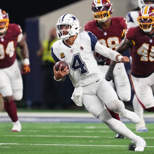 Dallas Cowboys quarterback Dak Prescott (4) runs against the Washington Commanders in the second half during an NFL football game in Arlington, Texas, Sunday, Sept. 20, 2026. (AP Photo/Tony Gutierrez)