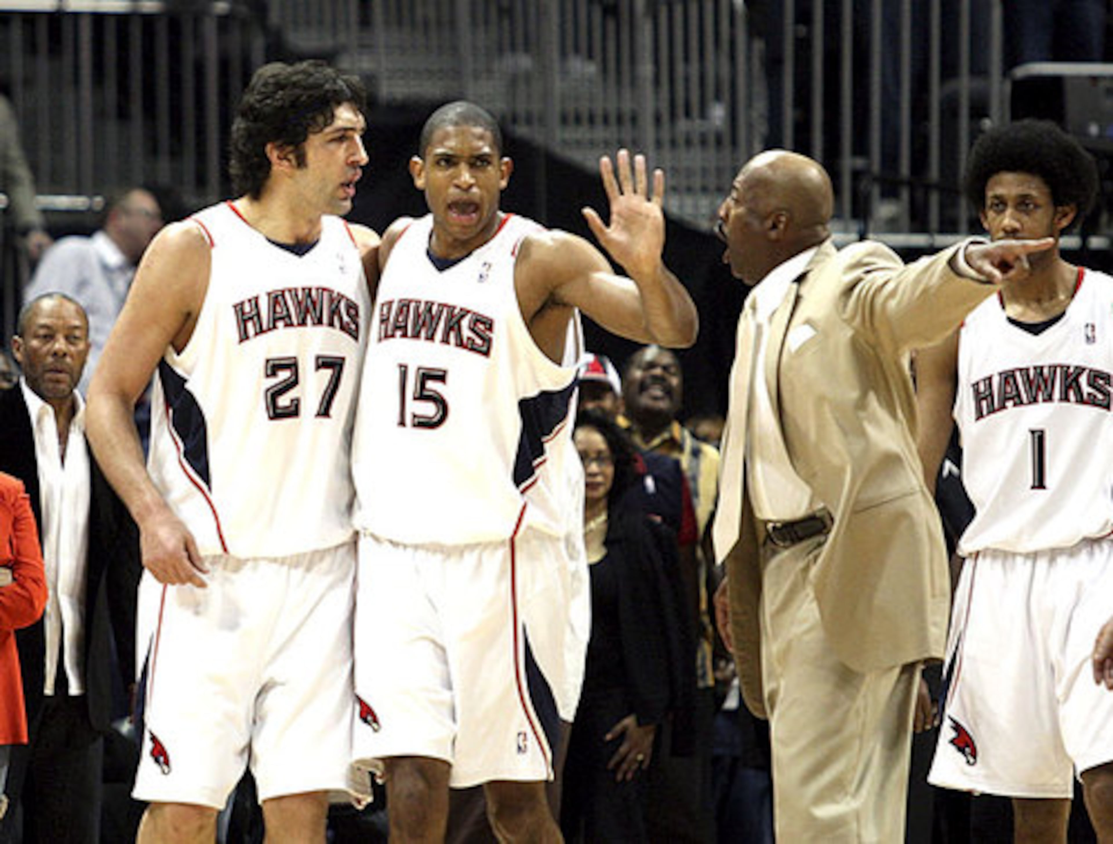 Zaza Pachulia (left) did not make the AJC's first team. Al Horford (center), on the other hand, did.