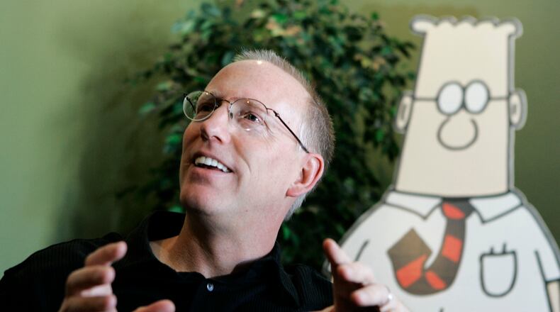 FILE - Scott Adams, creator of the comic strip Dilbert, talks about his work at his studio in Dublin, Calif., on Oct. 26, 2006. (AP Photo/Marcio Jose Sanchez, File)