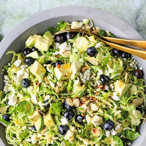 This Brussels sprout salad is dressed in a white balsamic vinaigrette and topped with fresh blueberries, sliced almonds and crumbly feta. (Reprinted with permission from “Every Salad Ever” by Greta Podleski, copyright © 2025. Published by Clarkson Potter, a division of Penguin Random House LLC)