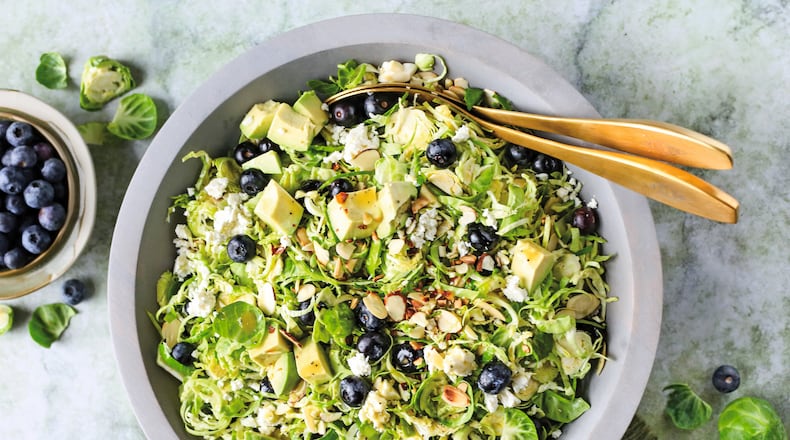 This Brussels sprout salad is dressed in a white balsamic vinaigrette and topped with fresh blueberries, sliced almonds and crumbly feta. (Reprinted with permission from “Every Salad Ever” by Greta Podleski, copyright © 2025. Published by Clarkson Potter, a division of Penguin Random House LLC)