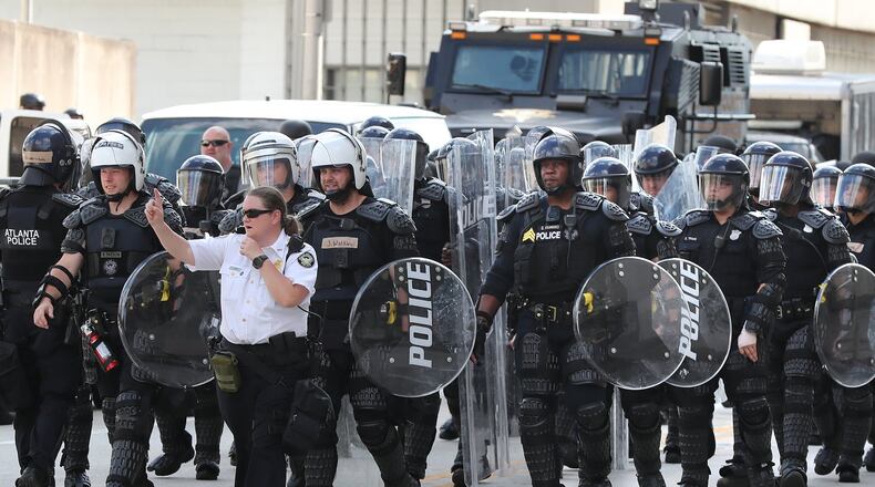 053120 Atlanta: Riot police move into position beside the CNN Center and Olympic Park as protests continue for a third day over the death of George Floyd in Minneapolis police custody on Sunday, May 31, 2020, in Atlanta. Curtis Compton ccompton@ajc.com