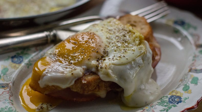 The classic croque madame, a grilled cheese topped with bechamel and a sunny-side-up egg. CONTRIBUTED BY HENRI HOLLIS