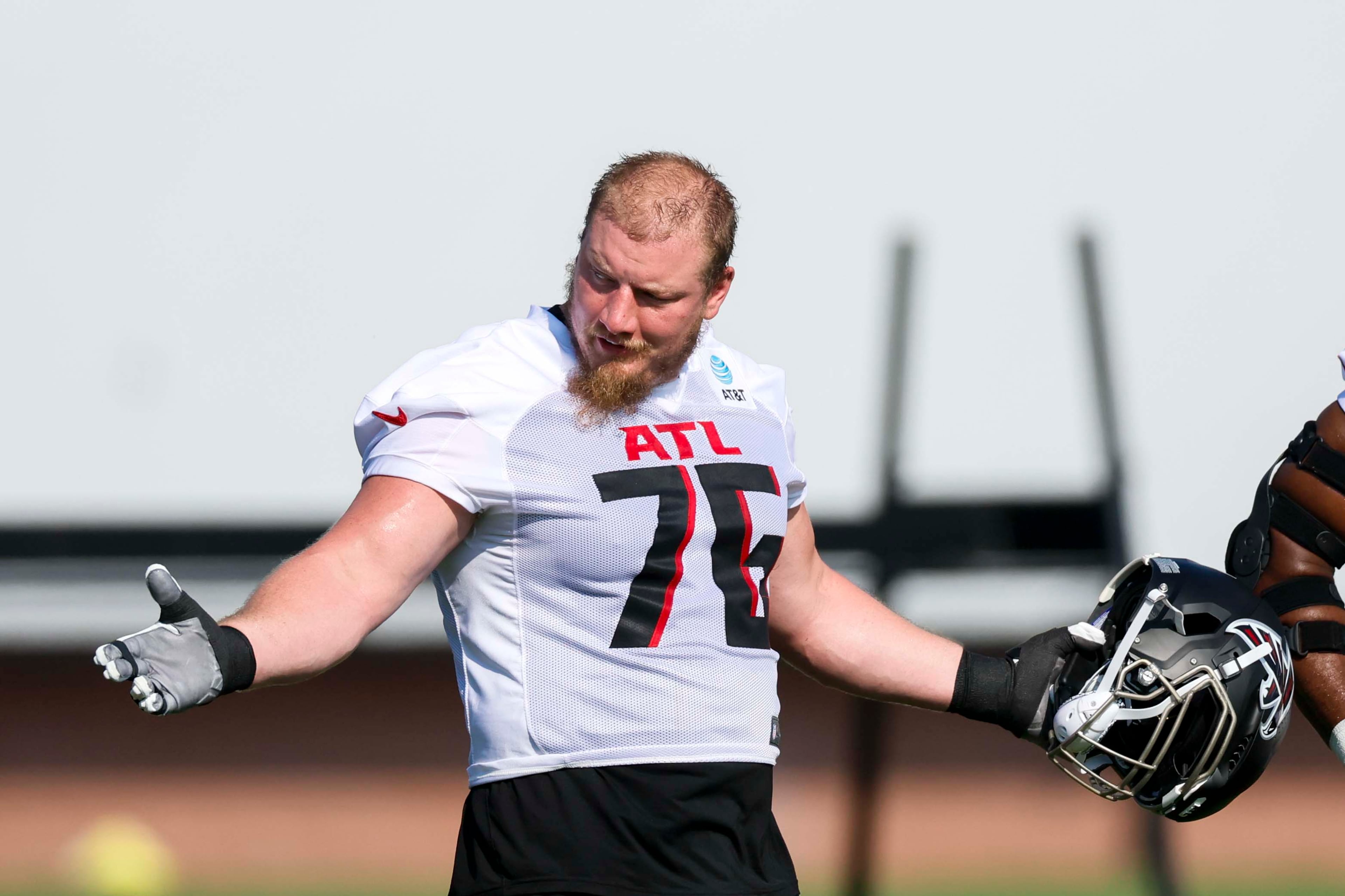 Atlanta Falcons offensive tackle Kaleb McGary reacts during the first practice of training camp on Thursday, July 24, 2025, in Flowery Branch. (Miguel Martinez/AJC)