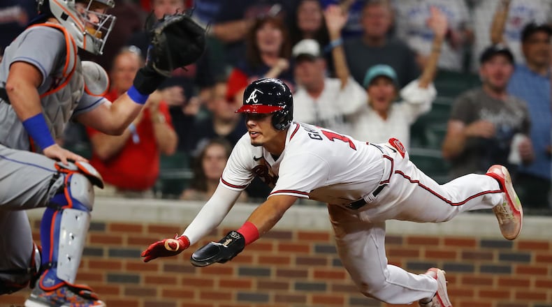 081822 Atlanta: Atlanta Braves second baseman Vaughn Grissom goes home past catcher James McCann to score the winning run on a RBI-single by Michael Harris to take a 3-2 lead over the New York Mets during the seventh inning in a MLB baseball game on Thursday, August 18, 2022, in Atlanta. The Braves beat the Mets 3-2 to win the series 3 games to 1. “Curtis Compton / Curtis Compton@ajc.com