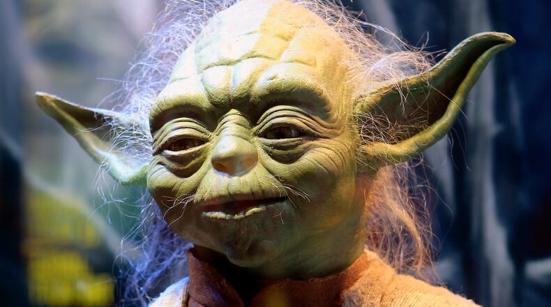 SAINT-DENIS, FRANCE - JUNE 26: The costume of character Yoda from the Star Wars film series is displayed during the exhibition 'Star Wars Identities' at the Cite du Cinema on June 26, 2014, in Saint-Denis, France.The exhibition is open from 15 February and displays more than 200 original pieces from the archives of Lucas Arts Museum, including models, props, costumes and sketches who built the Star Wars universe created by George Lucas. This exhibition has a lot of success and is extended until October 5, 2014, at the Cite du Cinema. (Photo by Chesnot/Getty Images)