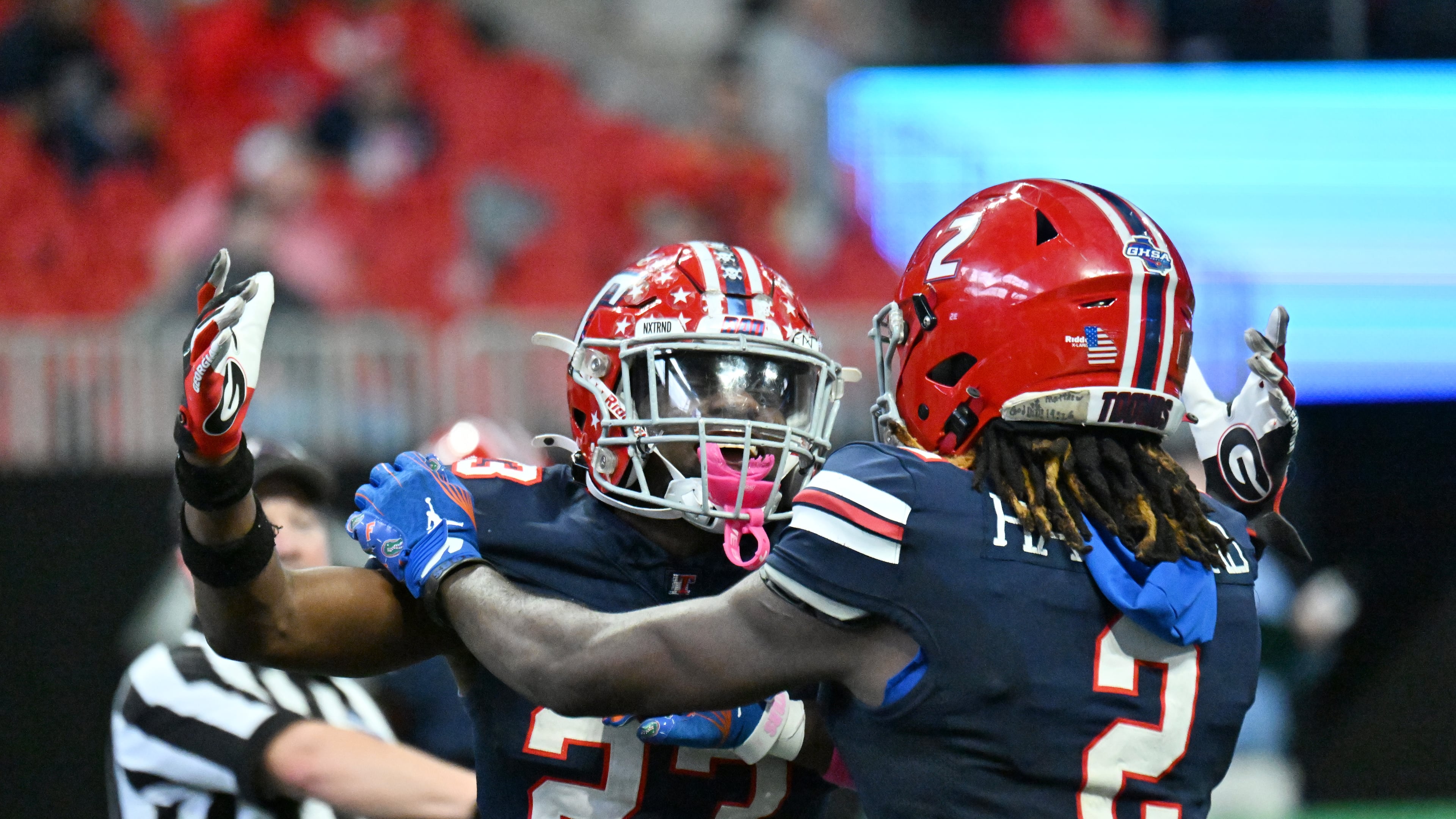 Toombs County's strong safety Alex Scott (left) and wide receiver Lagonza Hayward celebrate during the GHSA Class A-Division State Championship game at Mercedes-Benz Stadium on Tuesday, Dec. 17, 2024, in Atlanta. Toombs County has won its first-round game each of the past two seasons. (Hyosub Shin/AJC 2024)