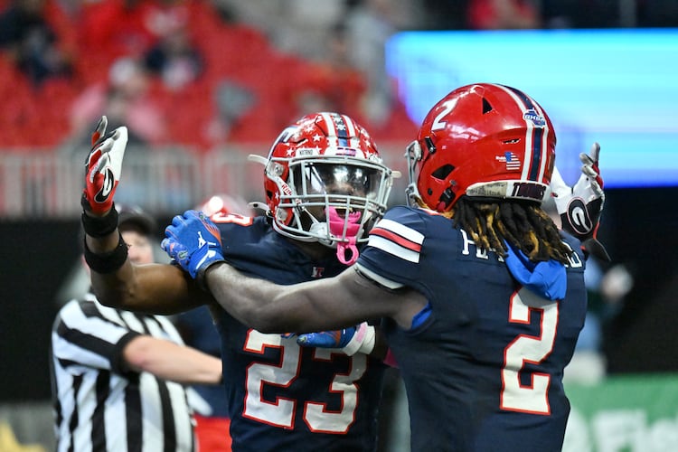 Toombs County's strong safety Alex Scott (left) and wide receiver Lagonza Hayward celebrate during the GHSA Class A-Division State Championship game at Mercedes-Benz Stadium on Tuesday, Dec. 17, 2024, in Atlanta. Toombs County has won its first-round game each of the past two seasons. (Hyosub Shin/AJC 2024)