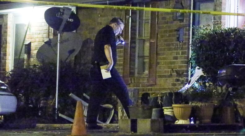 Police early Monday investigated a deadly shooting at a townhome on Parklane Drive in DeKalb County. JOHN SPINK / JSPINK@AJC.COM