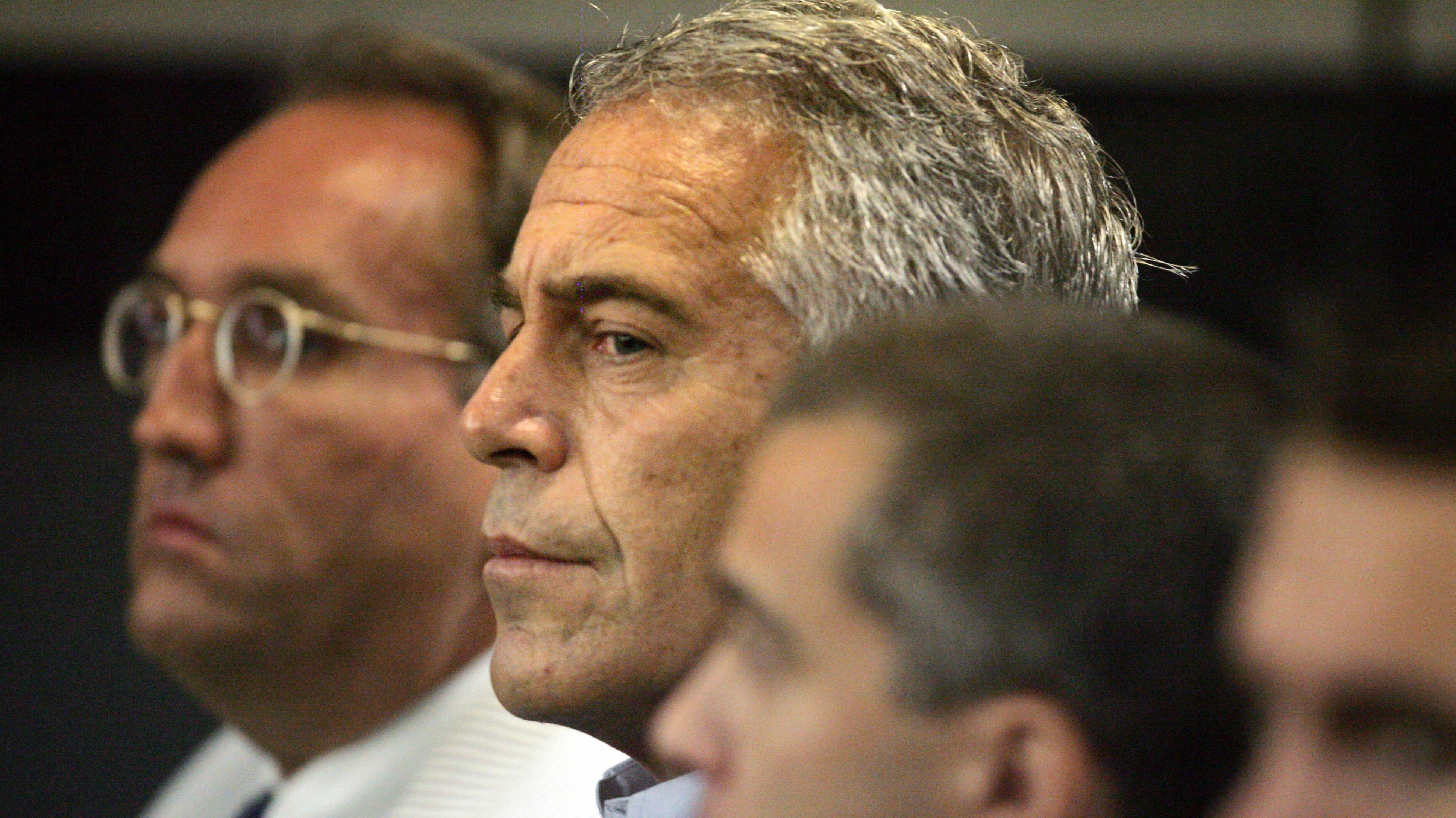 FILE - In this July 30, 2008, file photo, Jeffrey Epstein, center, appears in court in West Palm Beach, Fla. (Uma Sanghvi/The Palm Beach Post via AP, File)