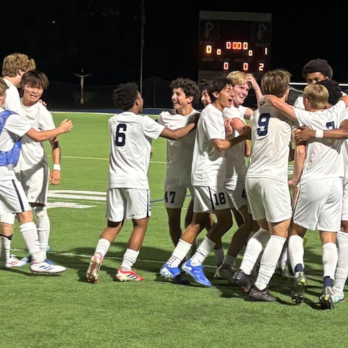 Whitefield Academy players celebrate on the field after their 1-0 victory over Hebron Christian in the Class 3A-A Private boys soccer championship game Tuesday, May 12, 2026, at St. Pius X High School in Atlanta. (Chip Saye/AJC)