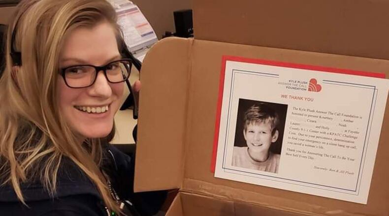Fayette Communications Training Officer Kourtney Rose was able to locate a female victim of domestic abuse, leading to her medical treatment and awards to Rose. She recently was nominated for employee of the year, received a Fayette County 911 Distinction Award and the memorial Kyle Plush Answer the Call (KPATC) Foundation Challenge Coin. (Courtesy of Fayette County)
