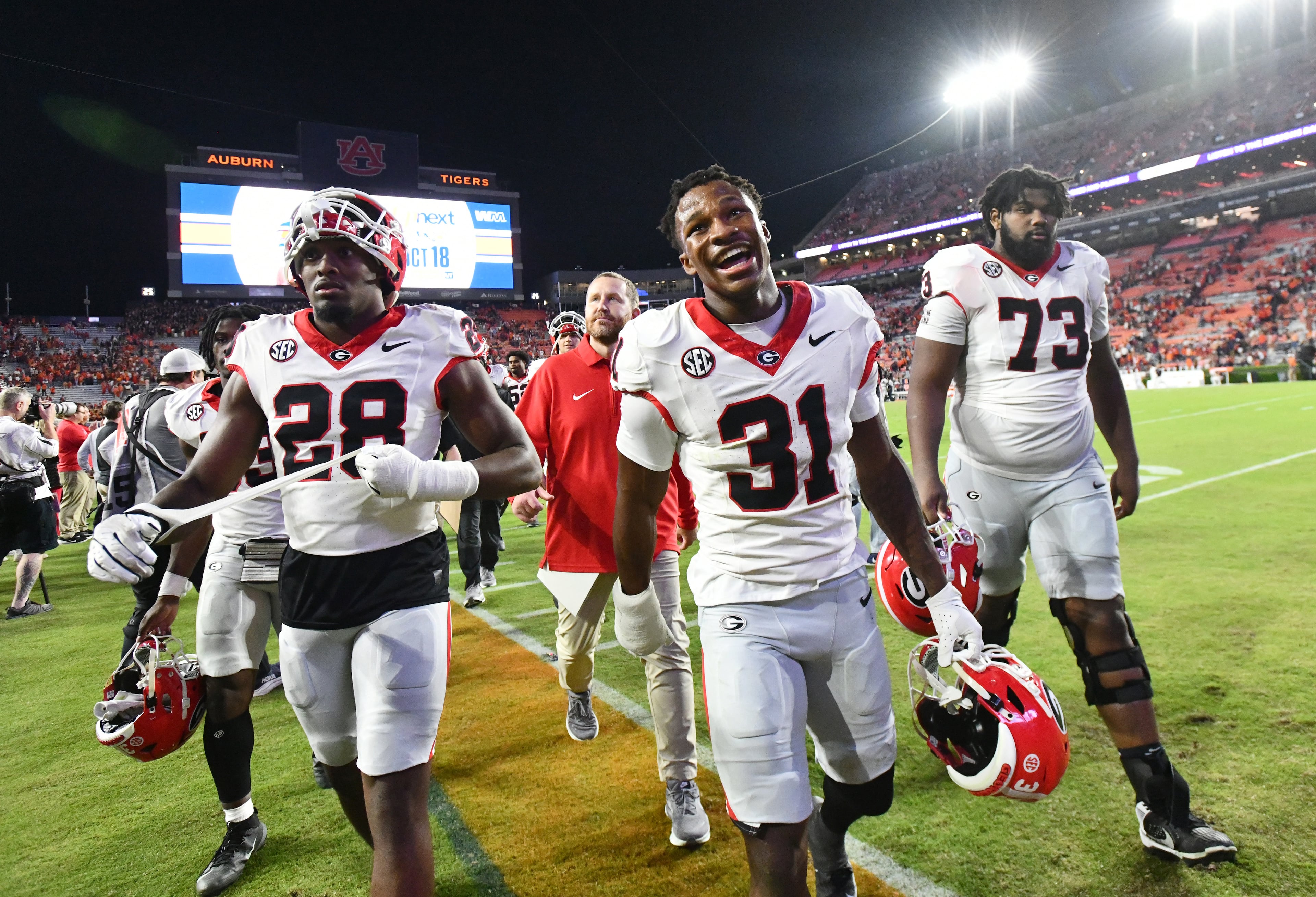 Georgia players react as they leave the field after Georgia beat Auburn during a NCAA college football game at Jordan-Hare Stadium, Saturday, October 11, 2025, in Auburn, Ala. Georgia won 20-10 overAuburn. (Hyosub Shin / AJC)