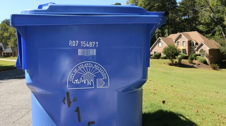 A team of city of Atlanta employees will inspect recycling bins on four of the city’s recycling routes to determine if they are contaminated or acceptable during the eight week “Feet on the Street” project. AJC file photo.