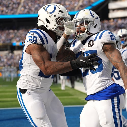 Indianapolis Colts running back Ameer Abdullah (26) celebrates a kickoff return with linebacker Buddy Johnson (59) against the Los Angeles Chargers during the second half of an NFL football game Sunday, Oct. 19, 2025, in Inglewood, Calif. (AP Photo/Gregory Bull)