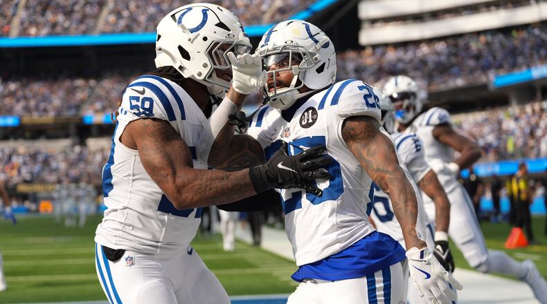 Indianapolis Colts running back Ameer Abdullah (26) celebrates a kickoff return with linebacker Buddy Johnson (59) against the Los Angeles Chargers during the second half of an NFL football game Sunday, Oct. 19, 2025, in Inglewood, Calif. (AP Photo/Gregory Bull)