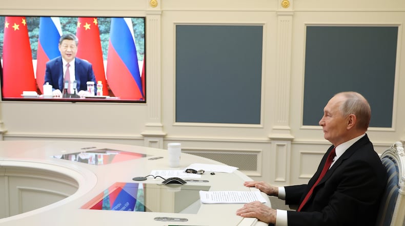 Russian President Vladimir Putin speaks with Chinese President Xi Jinping via videoconference at the Kremlin in Moscow, Wednesday, Feb. 4, 2026. (Vyacheslav Prokofyev/Sputnik, Kremlin Pool Photo via AP)