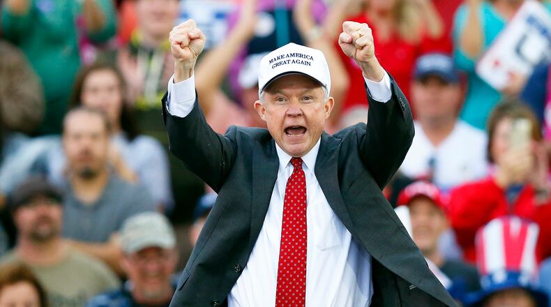 Attorney General-designate, Sen. Jeff Sessions, R-Ala., cheers on the crowd during a President-elect Donald Trump rally at the LaddPeebles Stadium, Saturday, Dec. 17, 2016, in Mobile, Ala. (AP Photo/Brynn Anderson)
