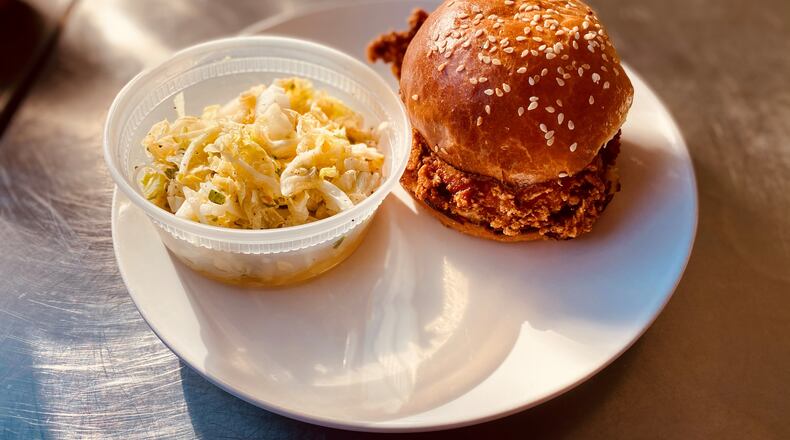 Hero Doughnuts & Buns serves a stellar fried chicken sandwich. It’s paired here with the crunchy slaw. Wendell Brock for The AJC