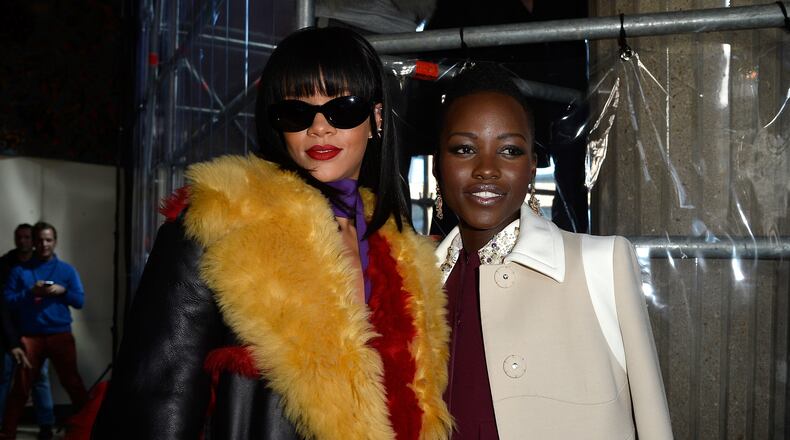 PARIS, FRANCE - MARCH 05: Singer Rihanna and actress Lupita Nyong'o attend the Miu Miu show as part of the Paris Fashion Week Womenswear Fall/Winter 2014-2015 on March 5, 2014 in Paris, France. (Photo by Pascal Le Segretain/Getty Images)