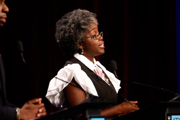 Democratic candidate for Congress Jasmine Clark, a state representative, speaks at the Atlanta Press Club Loudermilk-Young District 13 debate last week. (Arvin Temkar/AJC)