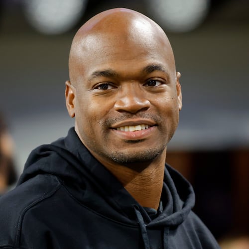 FILE - Former Minnesota Vikings running back Adrian Peterson stands on the field before an NFL football game between the Vikings and the Chicago Bears, Nov. 27, 2023, in Minneapolis. (AP Photo/Bruce Kluckhohn, File)