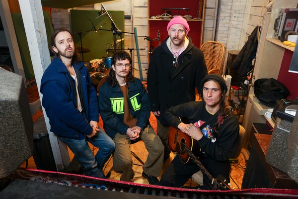 Improvement Movement — compiled of Zach Pyles (from left), Tony Aparo, Marshall Ruffin and Clark Hamilton — gather inside their studio in Pyles’ home on Thursday, Jan. 22, 2026, in Atlanta. Most of the group met in the city’s indie scene a decade ago. (Jason Getz/AJC)