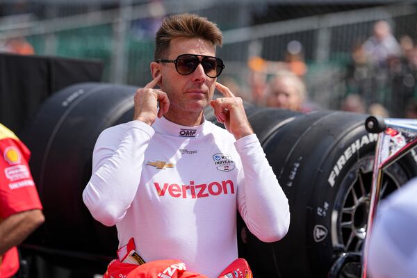 Will Power, of Australia, watches as he waits for is turn during qualification for the Indianapolis 500 auto race at Indianapolis Motor Speedway in Indianapolis, Saturday, May 17, 2025. (AP Photo/Michael Conroy)