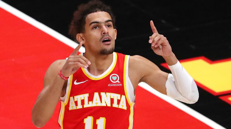 Hawks guard Trae Young reacts during first period action against the Washington Wizards  Wednesday, May 12, 2021, at State Farm Arena in Atlanta. Atlanta clinched a top-six playoff spot with a 120-116 win over the Wizards. (Curtis Compton / Curtis.Compton@ajc.com)