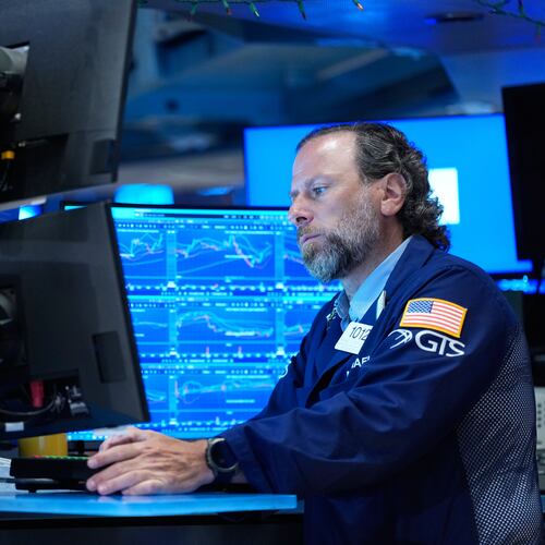 Michael Pistillo works on the floor at the New York Stock Exchange in New York, Monday, July 6, 2026. (AP Photo/Seth Wenig)