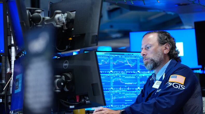 Michael Pistillo works on the floor at the New York Stock Exchange in New York, Monday, July 6, 2026. (AP Photo/Seth Wenig)