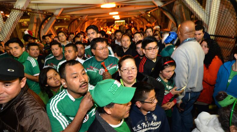March 5, 2014 Atlanta - A healthy crowd of fans flows into the Georgia Dome before an international friendly soccer match between Mexico and Nigeria on Wednesday, March 5, 2014. HYOSUB SHIN / HSHIN@AJC.COM